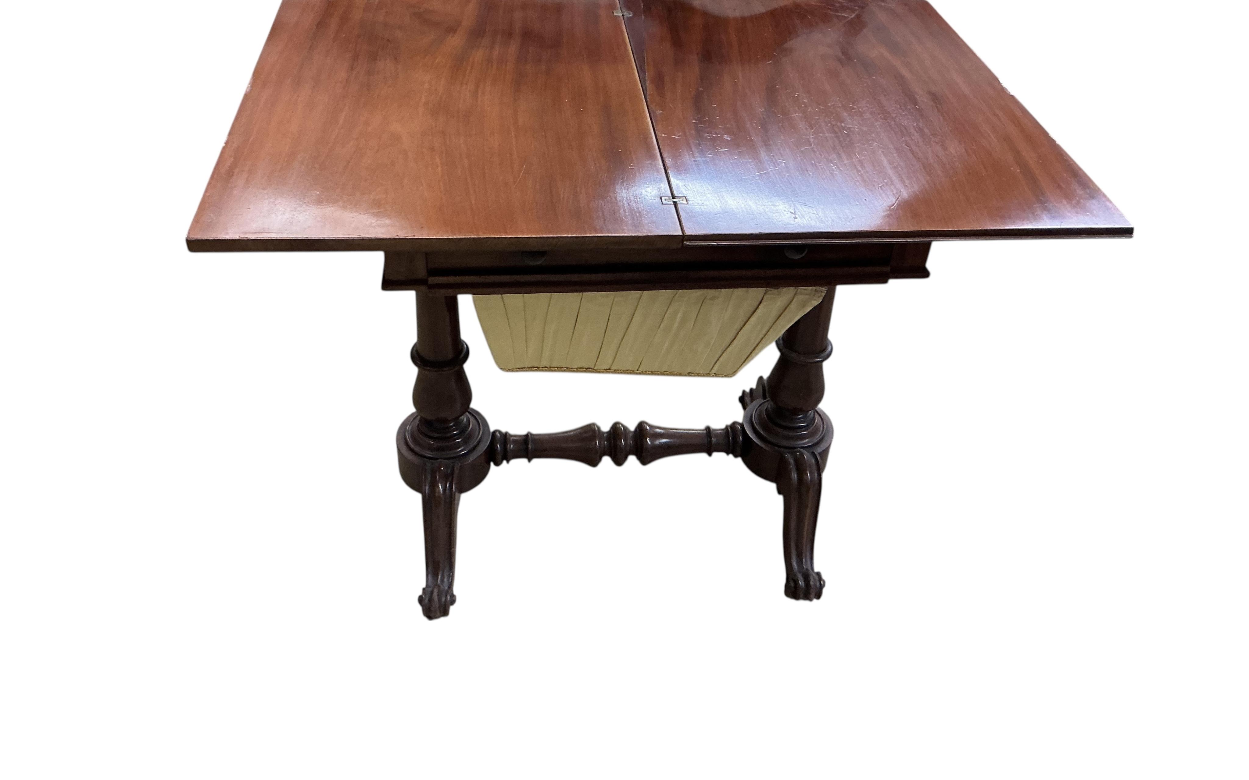 An early Victorian mahogany work / tea table with hinged swivel top, width 60cm, depth 44cm, height 70cm